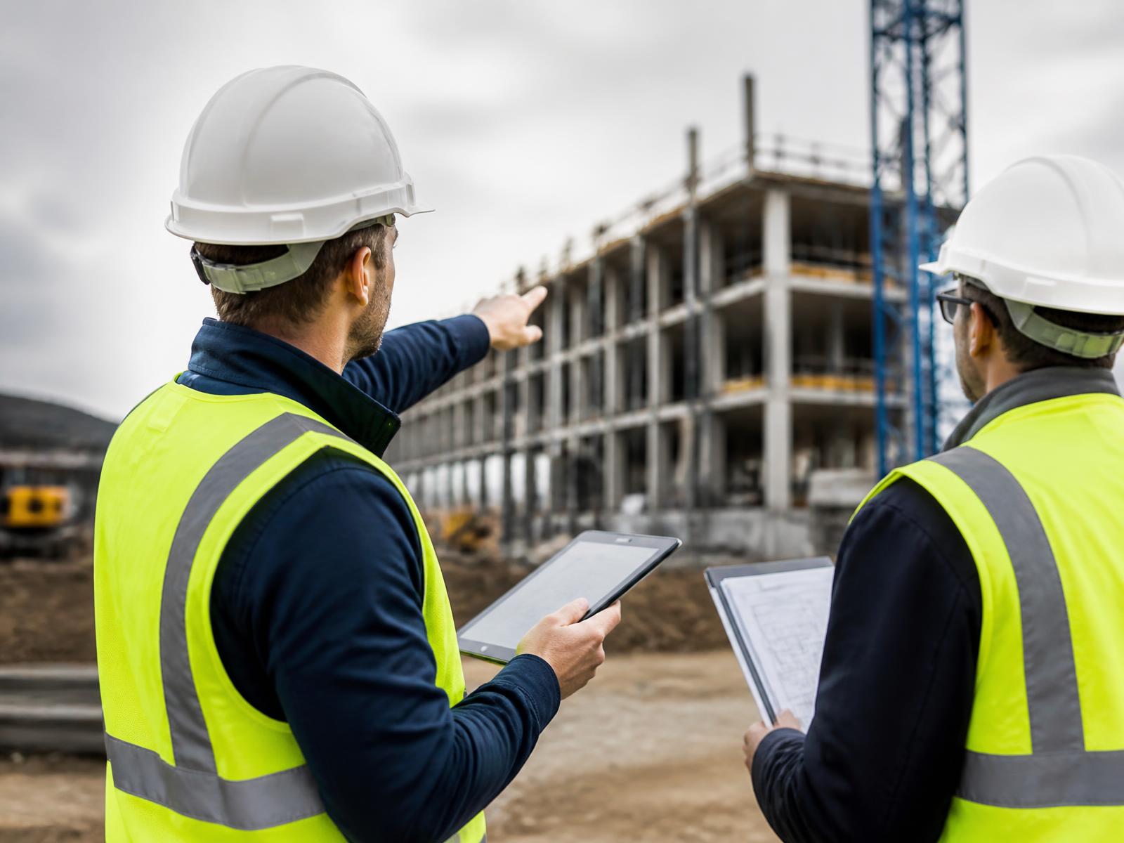 Site representative documenting construction progress on a tablet